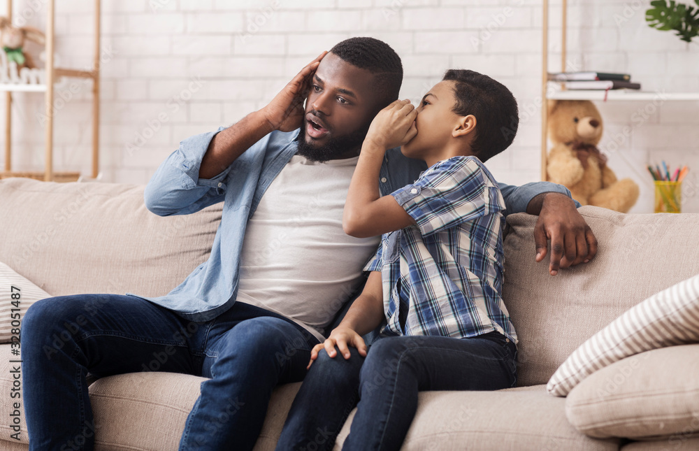Black Son Sharing Secret With Dad, Whispering To His Ear Black Son Sharing Secret With Dad, Whispering To His Ear