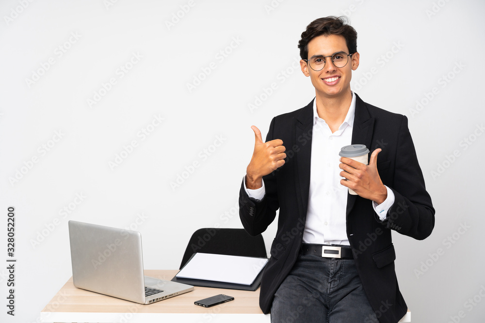 Businessman in his office over isolated white background giving a thumbs up gesture Businessman in his office over isolated white background giving a thumbs up gesture