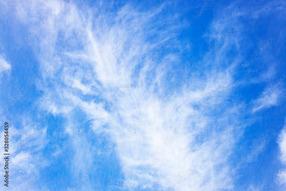 White cloud is developing on a blue background. White cloud is developing on a blue background.