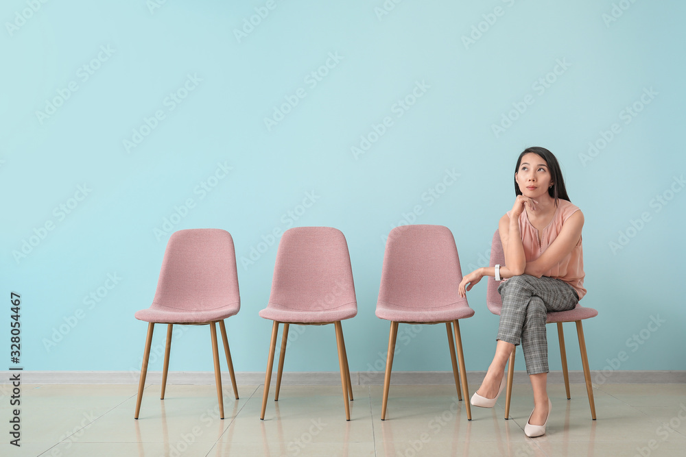 Fototapeta premium Young woman waiting for job interview indoors