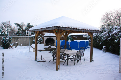 Park in winter with snow and pavilion © Lato-Pictures