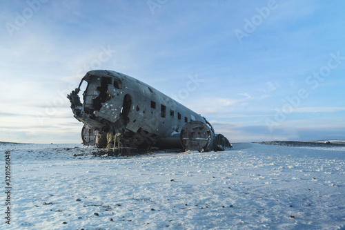Wreck of Old Plane on Icelandic Black Sand Beach. Amazing Landscape Background.