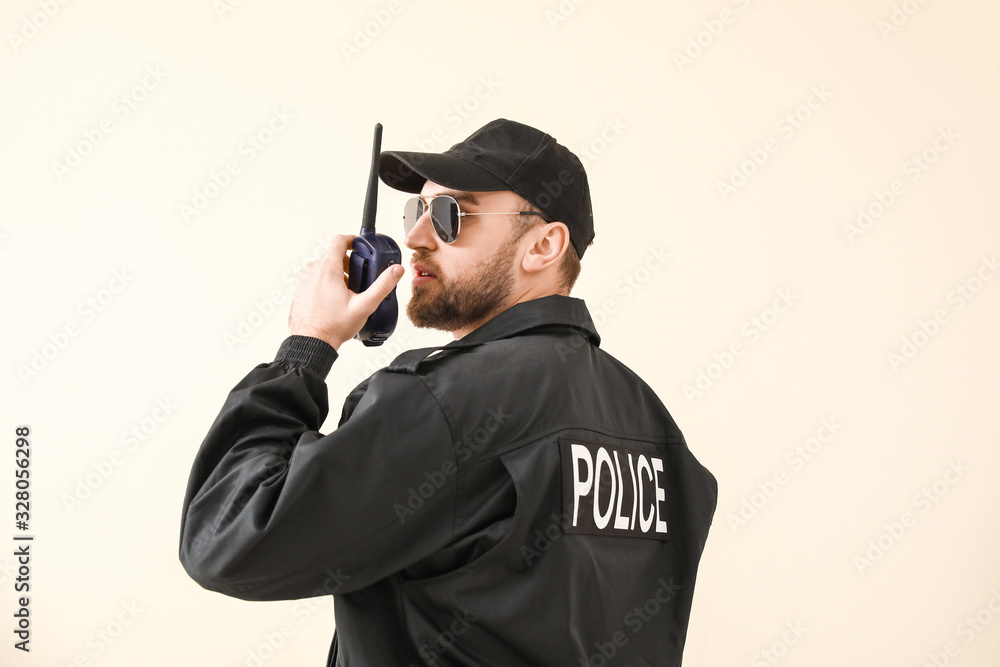Male police officer on color background Male police officer on color background