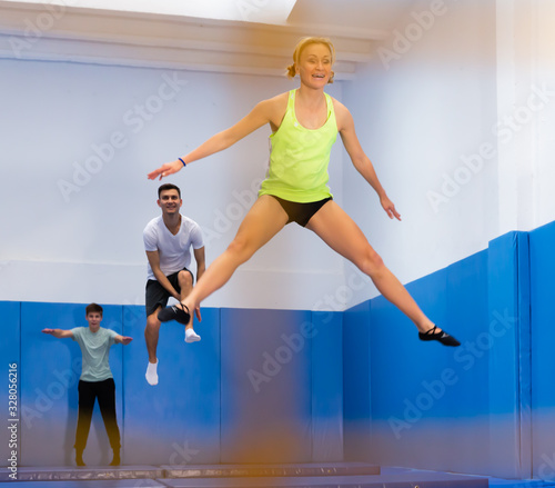 People training in trampoline center