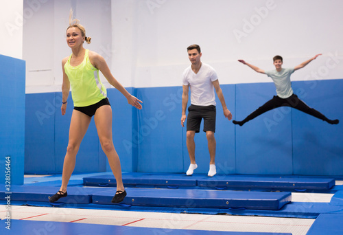 Woman jumping in trampoline center