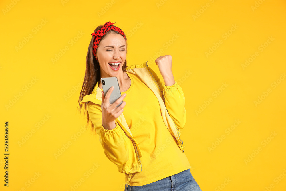 Happy young woman with mobile phone on color background Happy young woman with mobile phone on color background