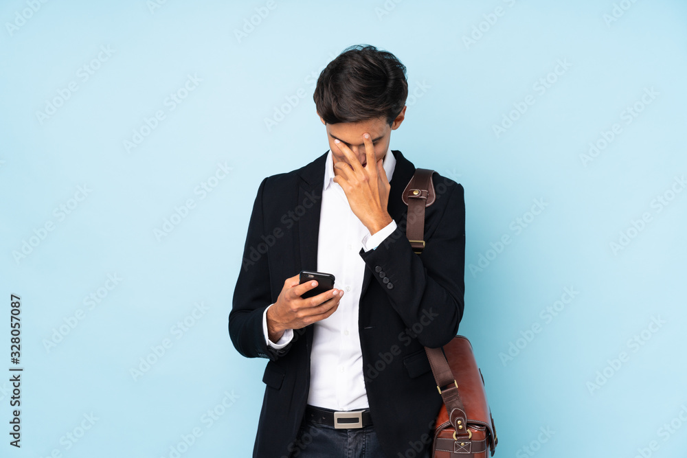 Businessman over isolated blue background laughing Businessman over isolated blue background laughing