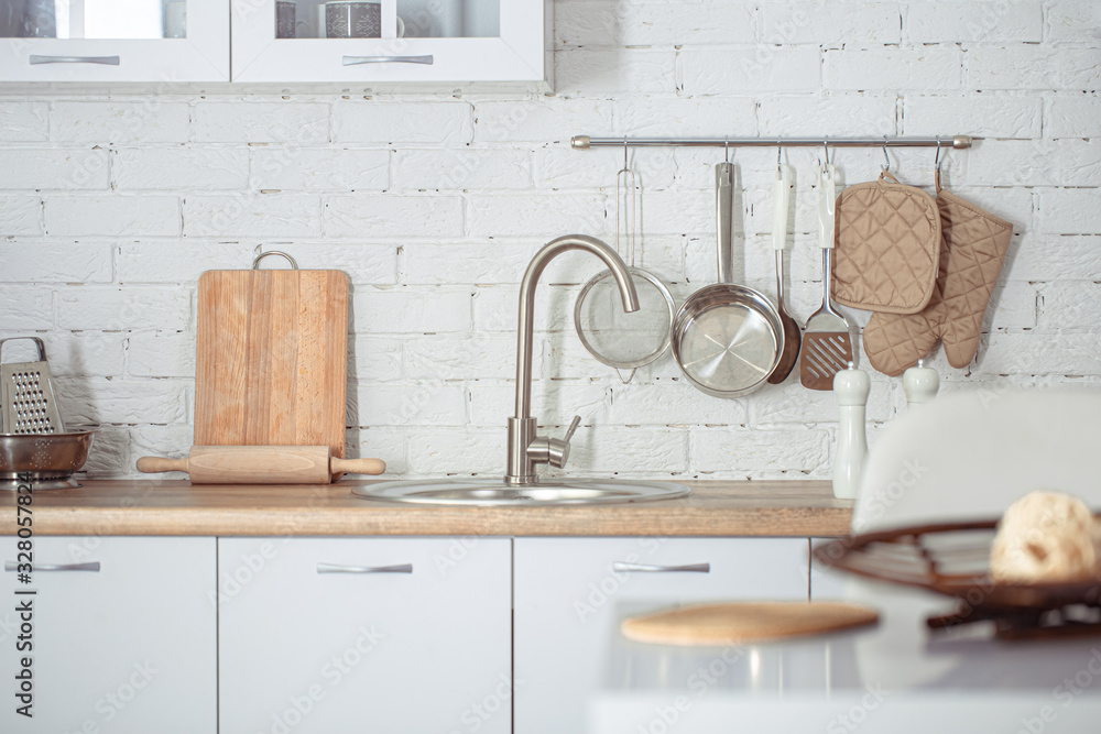 Modern stylish Scandinavian kitchen interior with kitchen accessories.  Stock Photo by puhimec