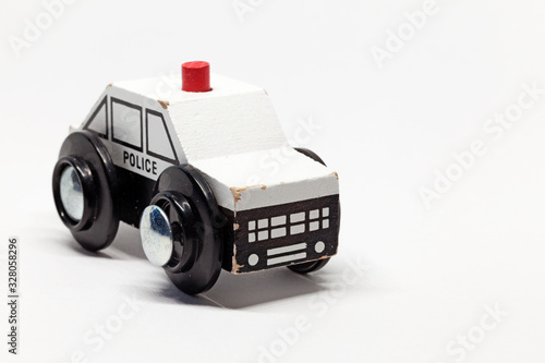 toy police car made of wood with siren photo