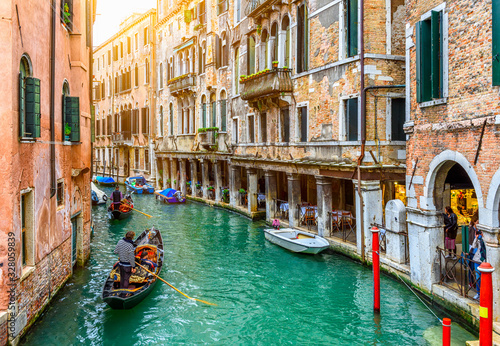 Narrow canal with gondola in Venice, Italy. Architecture and landmark of Venice. Cozy cityscape of Venice. © Ekaterina Belova