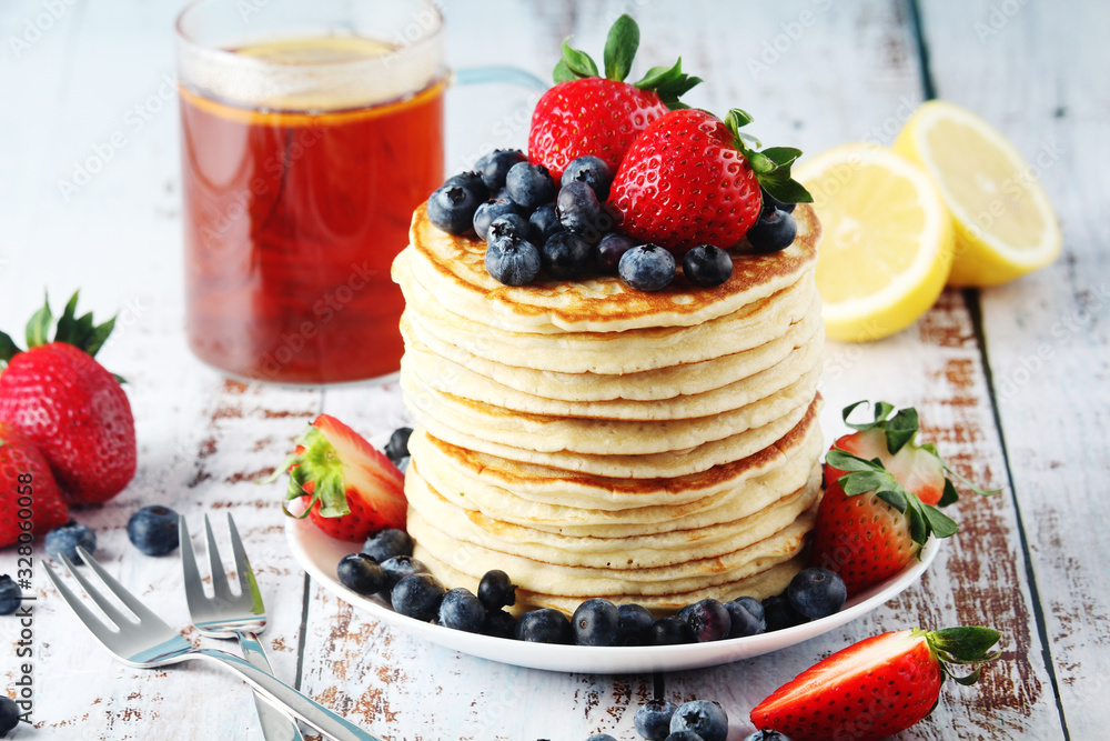 A stack if home-made pancakes with berry A stack if home-made pancakes with berry