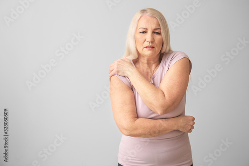 Senior woman suffering from...