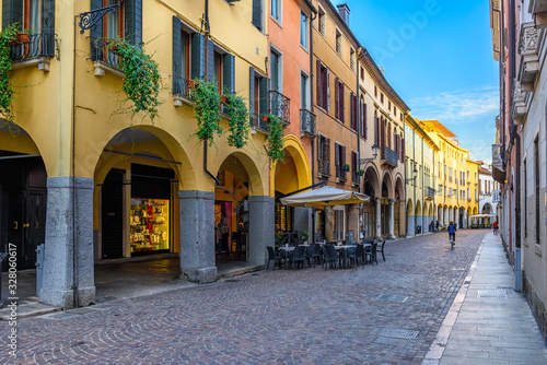 Fototapeta Naklejka Na Ścianę i Meble -  Old street with tables of trattoria in Padua (Padova), Veneto, Italy