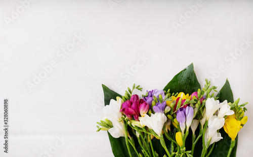 Colorful wildflowers isolated on a white background. Happy Easter concept. Copy space. Top view
