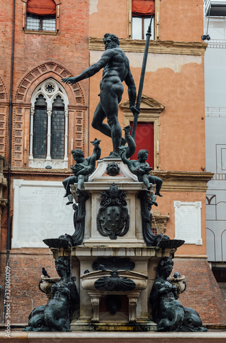 The Fountain of Neptune (Fontana di Nettuno) located in Piazza del Nettuno in Bologna, Italy. Architecture and landmark of Bologna. Cityscape of Bologna.