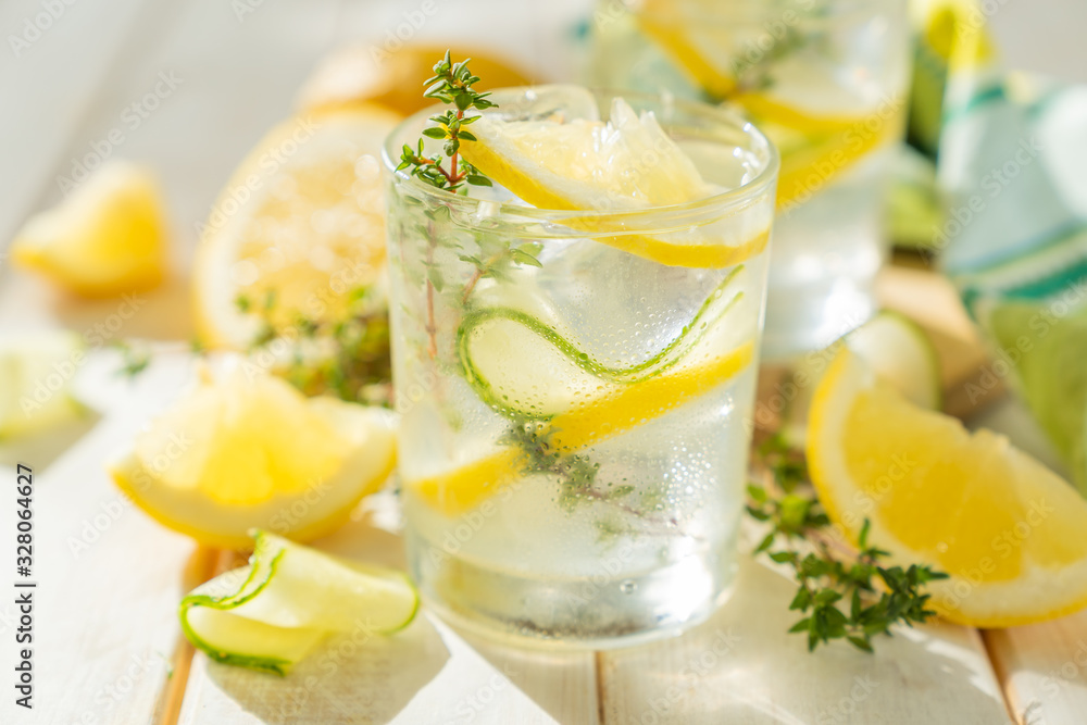 Detox drinks infused water and ingredients on wood background, copy space Detox drinks infused water and ingredients on wood background, copy space