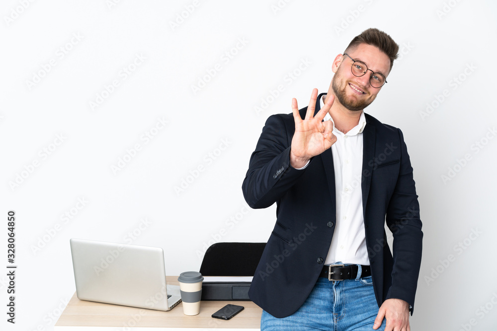 Russian man in a office isolated on white background happy and counting three with fingers Russian man in a office isolated on white background happy and counting three with fingers