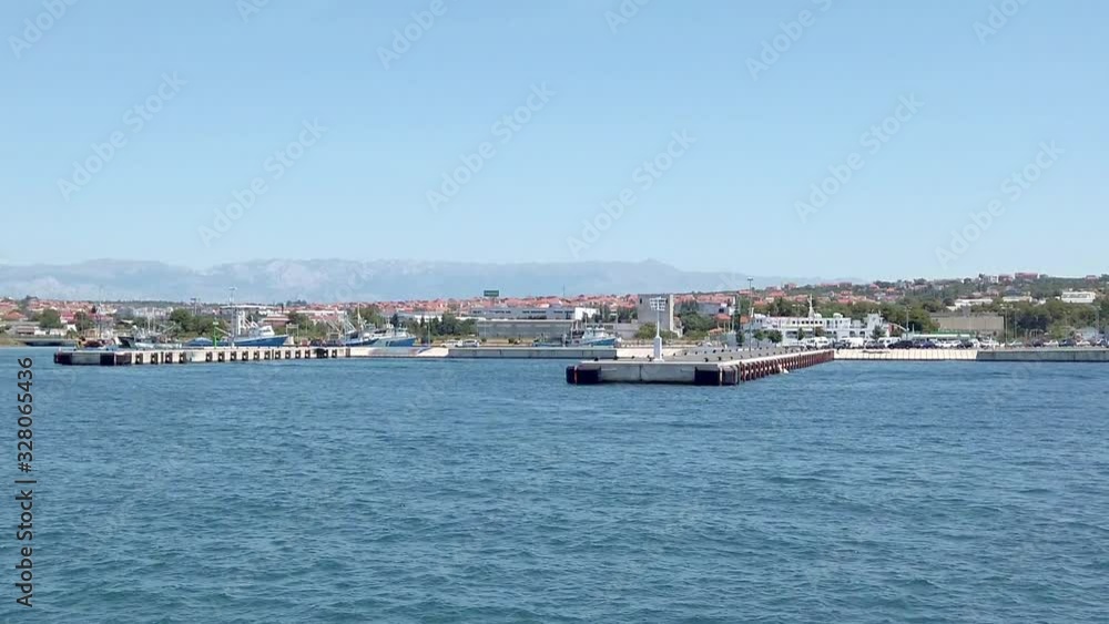 Ferry closing to the new port of Croatian city of Zadar. Filming beautiful adriatic surroundings while visiting Croatia. Ferry closing to the new port of Croatian city of Zadar. Filming beautiful adriatic surroundings while visiting Croatia.