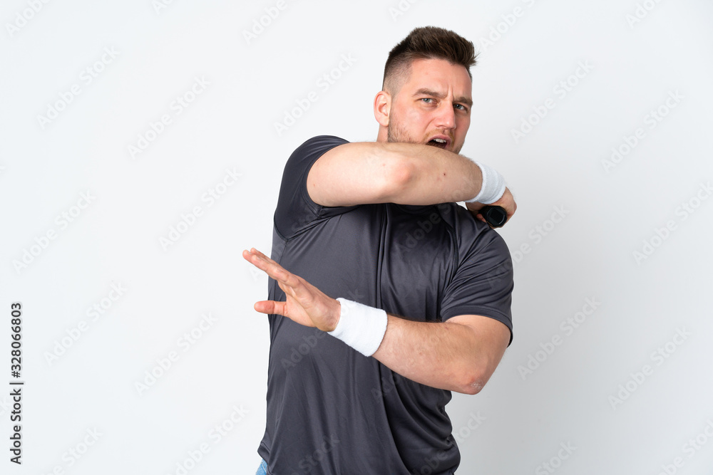 Russian handsome man isolated on white background playing tennis Russian handsome man isolated on white background playing tennis