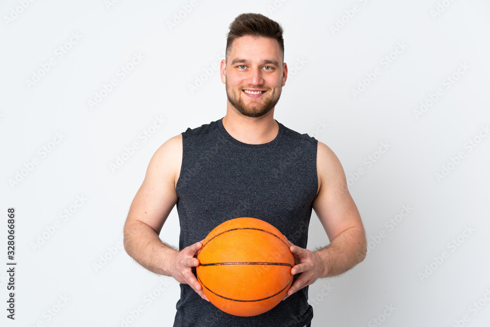 Russian handsome man isolated on white background playing basketball