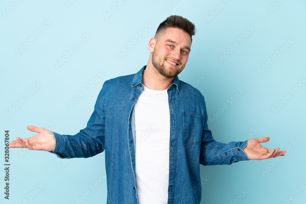 Russian handsome man isolated on blue background happy and smiling Russian handsome man isolated on blue background happy and smiling