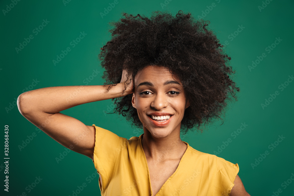 Fototapeta premium Portrait of a happy young african woman standing