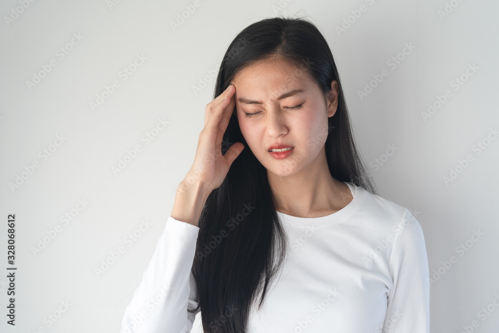 young asian women have a headaches from migraine isolated on white background. young asian women have a headaches from migraine isolated on white background.