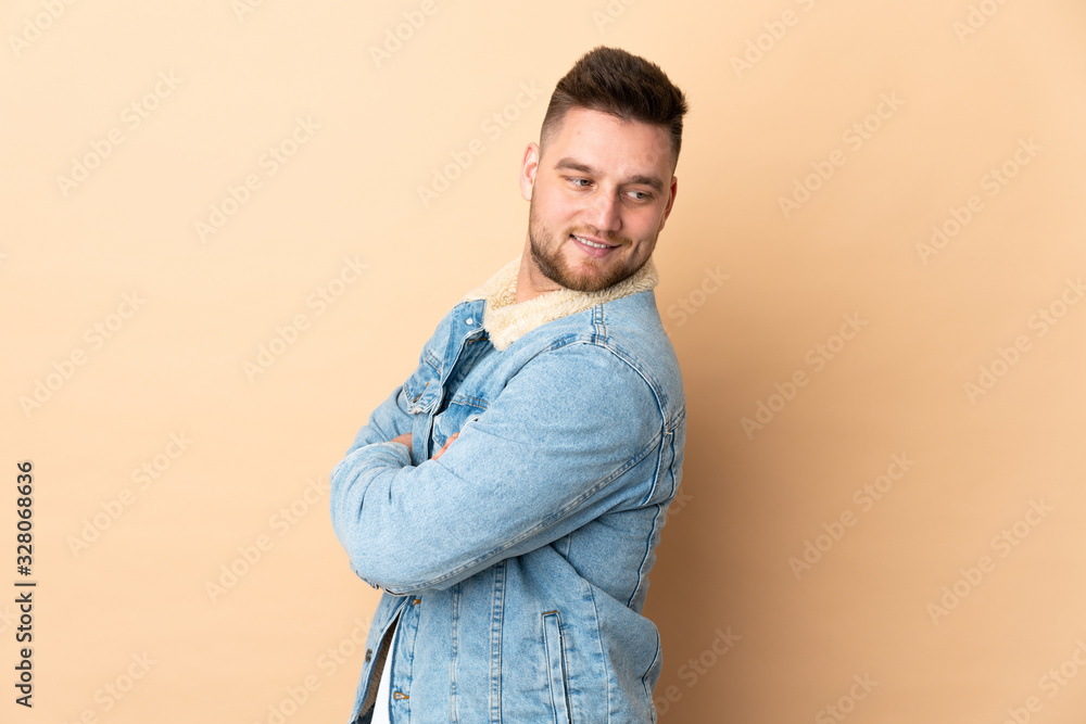 Russian handsome man over isolated background looking to the side and smiling Russian handsome man over isolated background looking to the side and smiling