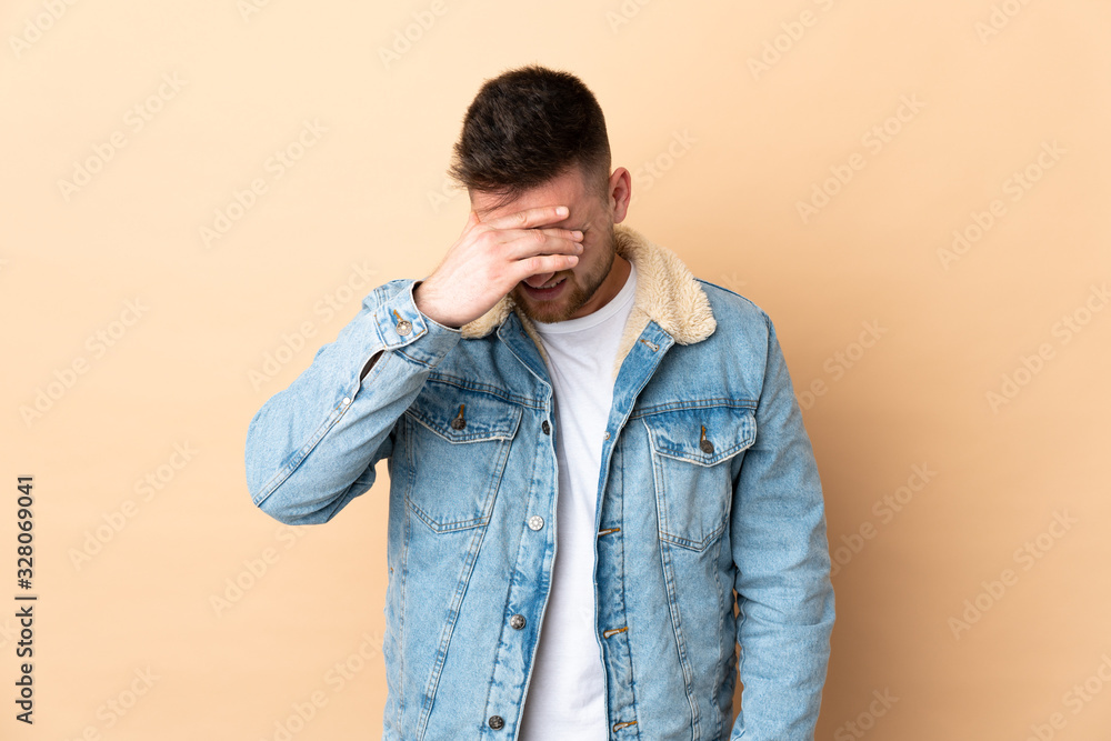 Russian handsome man over isolated background with headache Russian handsome man over isolated background with headache
