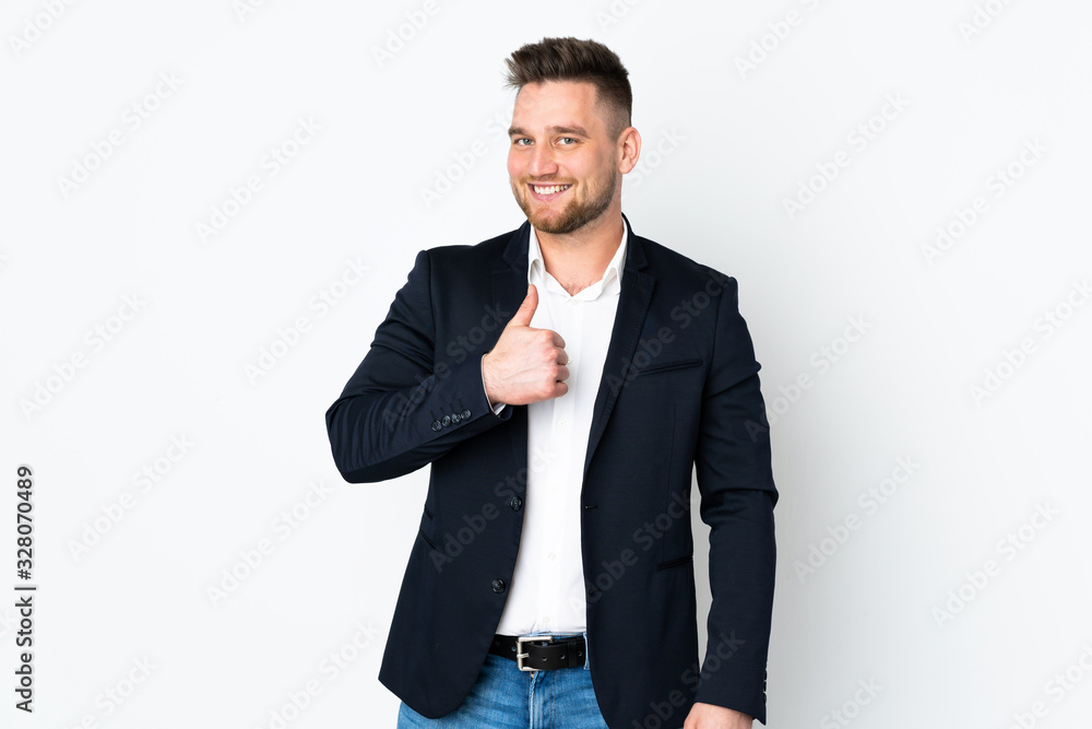 Young Russian business man isolated on white background giving a thumbs up gesture Young Russian business man isolated on white background giving a thumbs up gesture