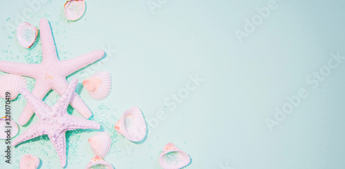top view of hat and sea shell on light green paper plank floor for summer vacation time background