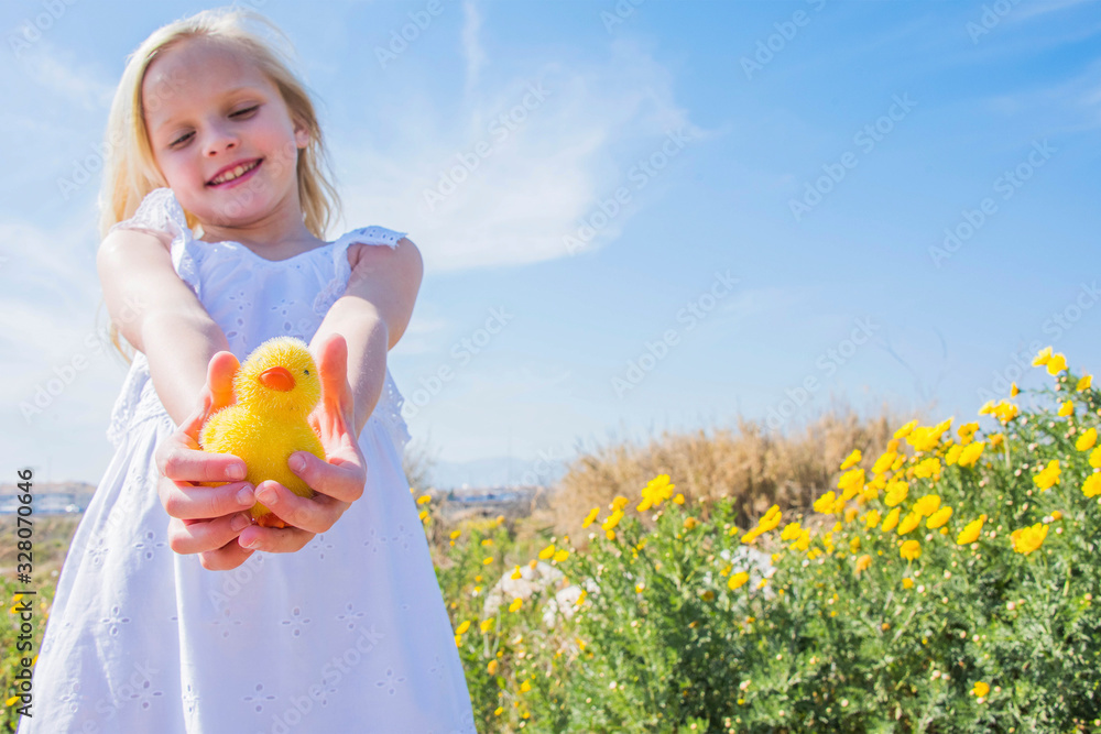 Little girl holding a cute duckling in the hands Little girl holding a cute duckling in the hands