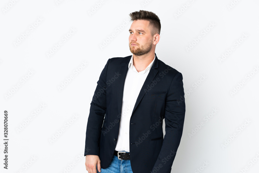 Young Russian business man isolated on white background looking side Young Russian business man isolated on white background looking side