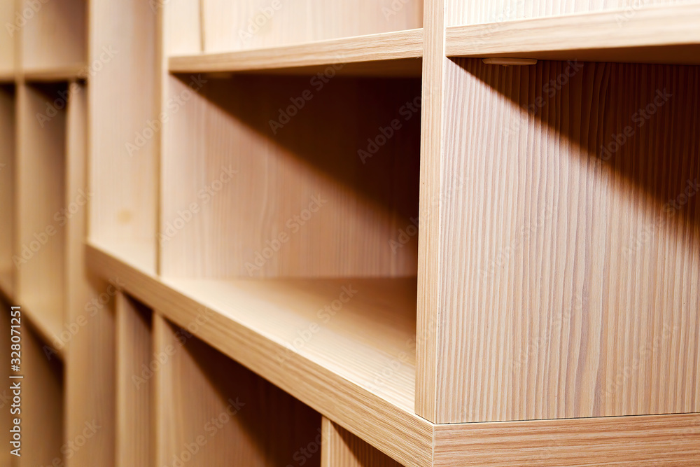 Wooden bookcase shelves from pine wood. Background texture pattern. Modern home furniture