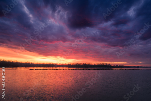 Storm clouds at sunrise on the Vistula near Konstancin-Jeziorna, Poland photo