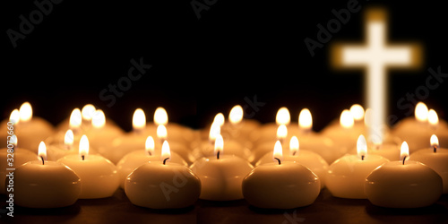 christening cross with candle