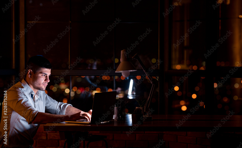 Entrepreneur Guy Working On Laptop Creating Startup Overnight In Office Entrepreneur Guy Working On Laptop Creating Startup Overnight In Office