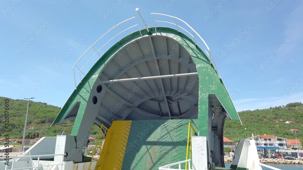 Ferry Closing Ramp Ferry leaving loading dock and closing up loading ramp. Filming ...