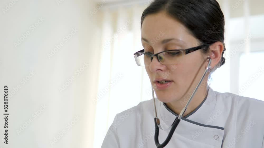 Pregnant woman with doctor in hospital - indoors Pregnant woman with doctor in hospital - indoors