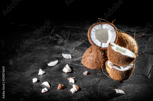 Coconut with half on dark background