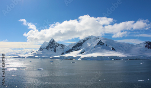 Frozen coasts, icebergs and mountains of the Antarctic Peninsula. The mountains at Paradise Bay on the Danco Coast, Antarctica © Marco Ramerini