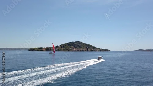PASMAN, CROATIA, 2019.06.18: Sailing boats and yachts passing by ferry. Filming beautiful adriatic surroundings while visiting Croatia.