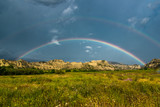 Double rainbow over the hills