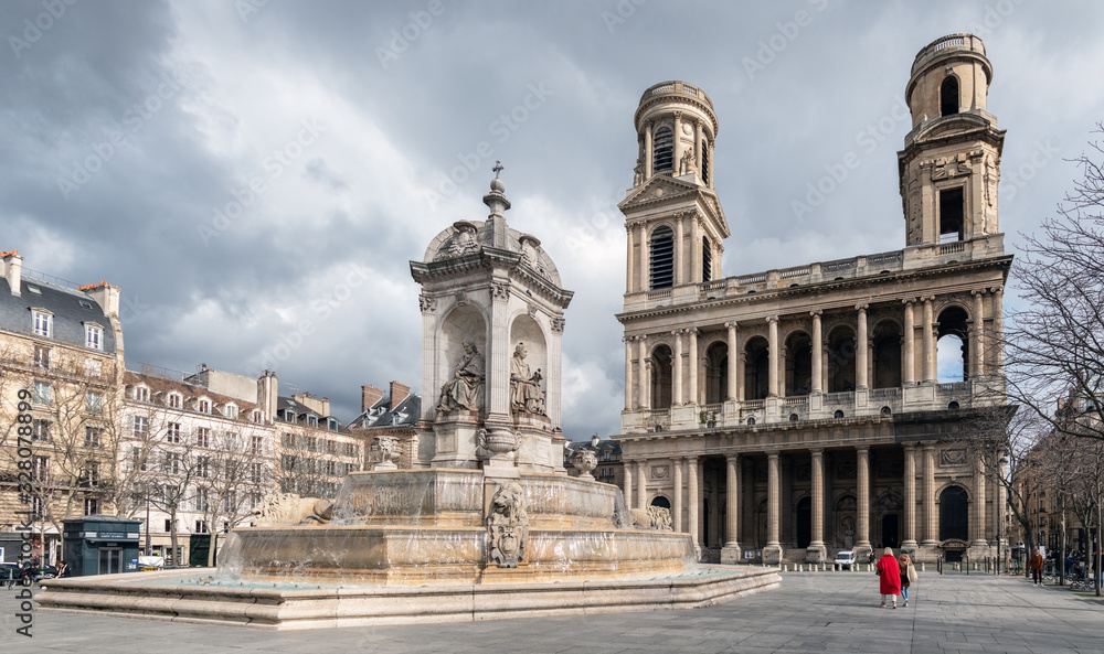 Church and fountain of Saint Sulpice in winter