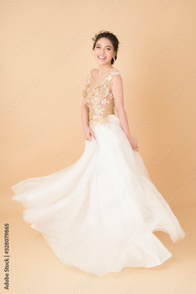 Fototapeta premium Beautiful bride in gorgeous couture dress