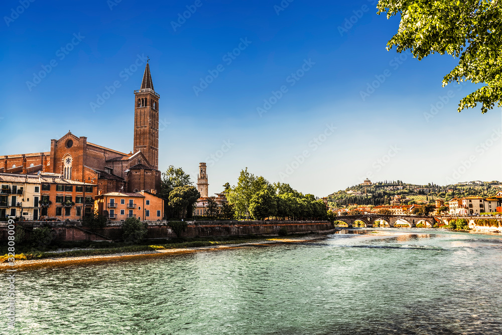 A view of the river Adige with the Church of St. Anastasia, Verona, Italy