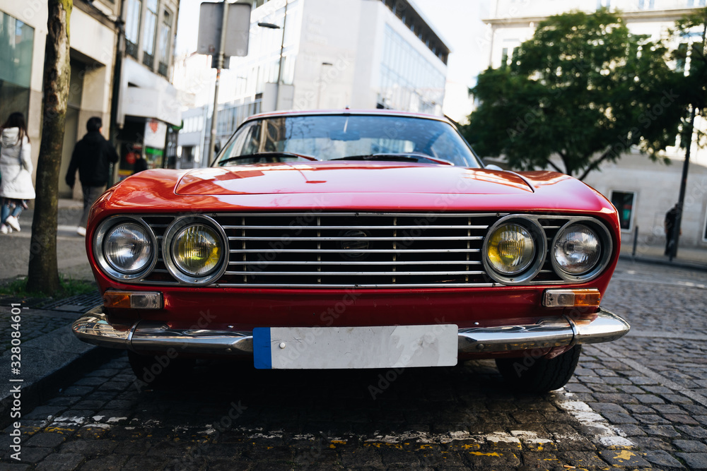 Old and red muscle car close up with beautiful reflections - obrazy, fototapety, plakaty 