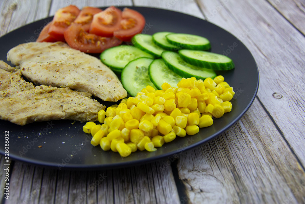 Chicken fillet with cucumbers, tomatoes and canned corn Chicken fillet with cucumbers, tomatoes and canned corn