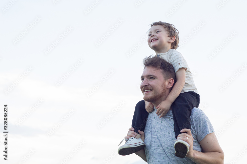 Happy loving family. Father and his son baby boy playing and hugging outdoors. Happy loving family. Father and his son baby boy playing and hugging outdoors.