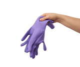 female hand holds a pair of purple rubber gloves for cleaning the house